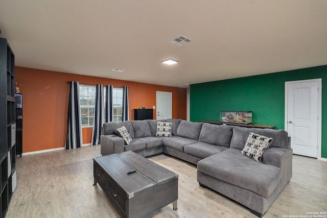 living room with light hardwood / wood-style flooring