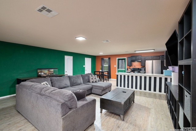 living room featuring light wood-type flooring