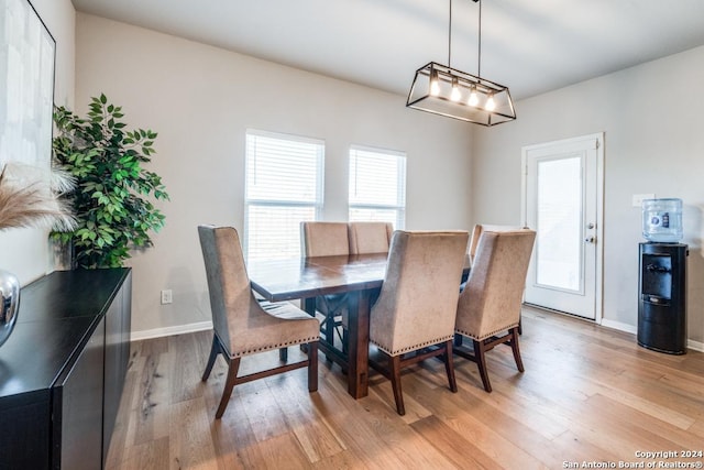 dining area featuring light wood-type flooring