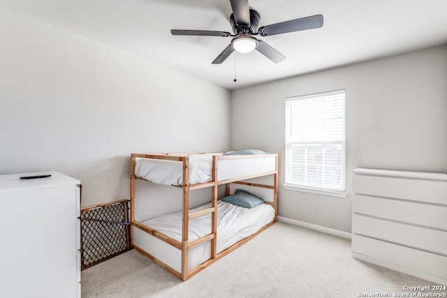 carpeted bedroom featuring ceiling fan