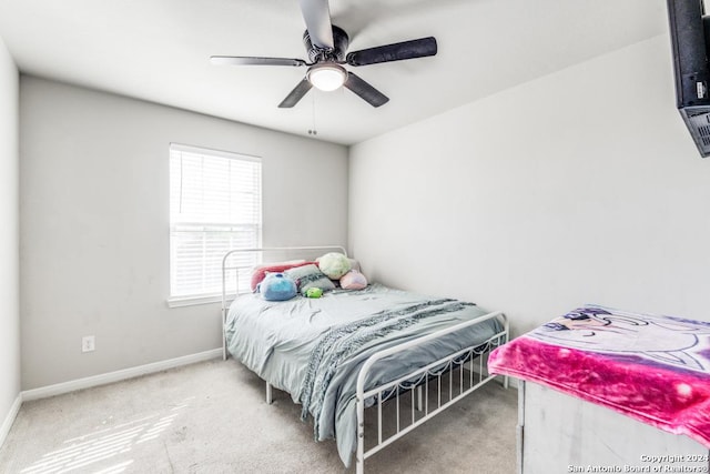 bedroom with ceiling fan and carpet