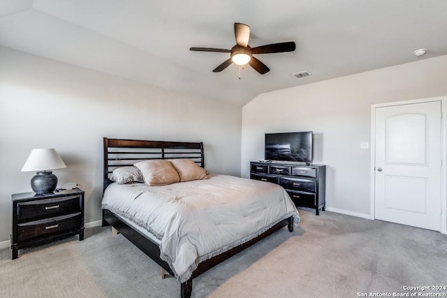 bedroom featuring lofted ceiling, light carpet, and ceiling fan