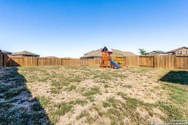 view of yard with a playground