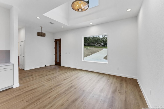 unfurnished living room with light hardwood / wood-style flooring