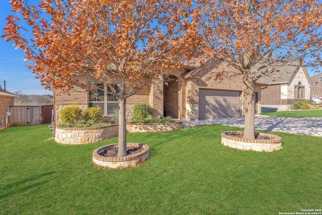 view of front facade with a garage and a front yard