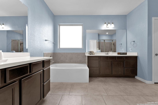 bathroom with vanity, separate shower and tub, and tile patterned floors