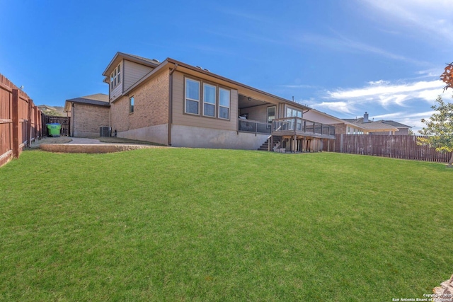 rear view of house featuring a patio and a lawn