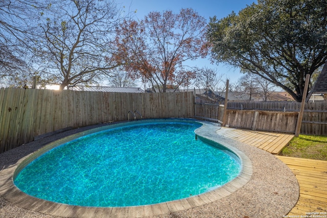 view of pool featuring a wooden deck