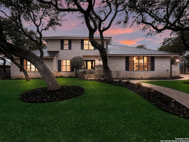 view of front of house with a yard