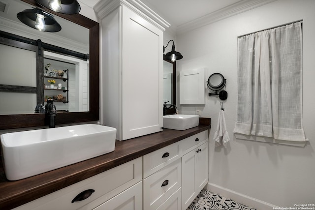 bathroom with vanity and crown molding