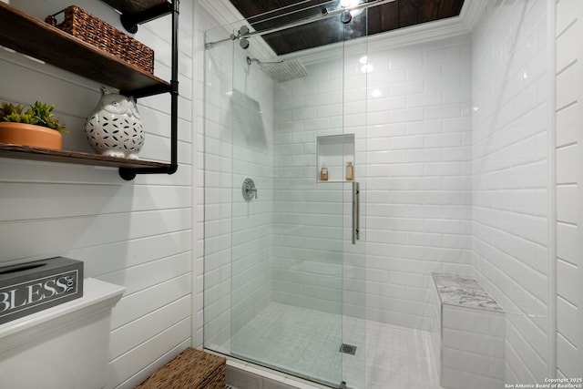 bathroom featuring a shower with door