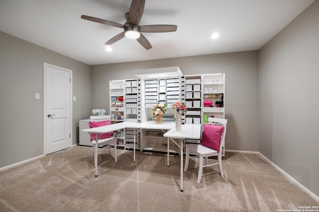 carpeted office featuring ceiling fan