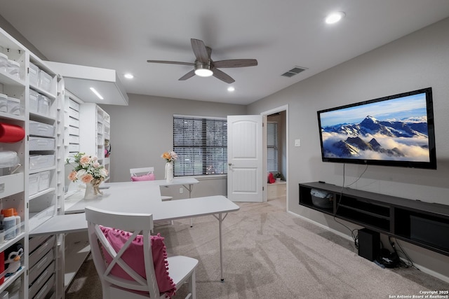 office area featuring light colored carpet and ceiling fan