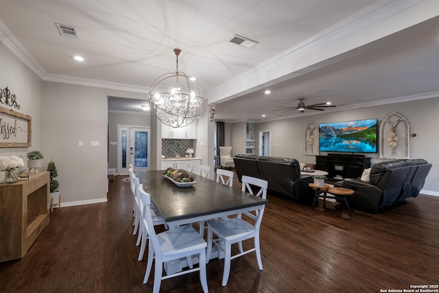 dining space featuring dark wood-type flooring, ornamental molding, and ceiling fan