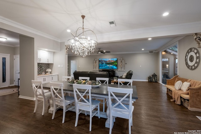 dining space featuring dark hardwood / wood-style flooring, a notable chandelier, and crown molding