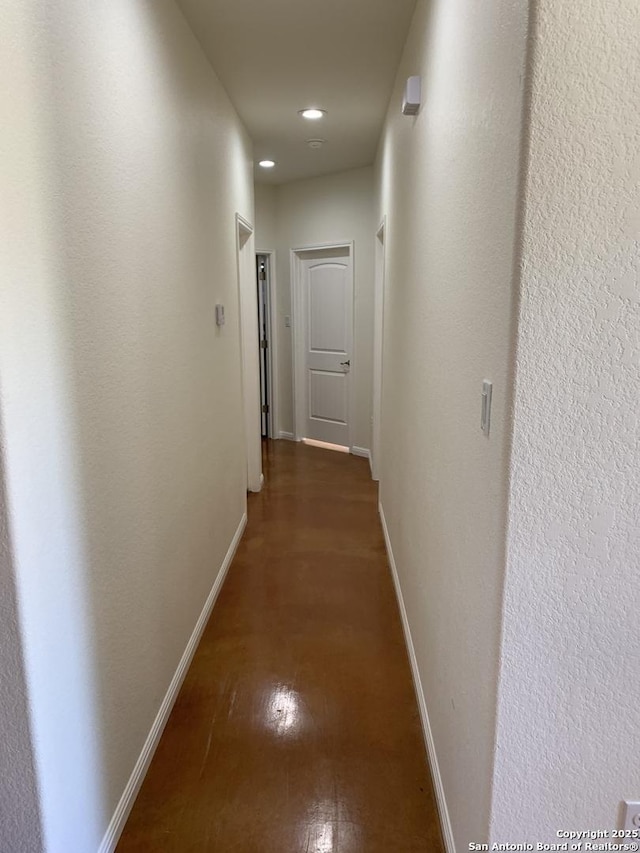 hallway featuring dark hardwood / wood-style floors