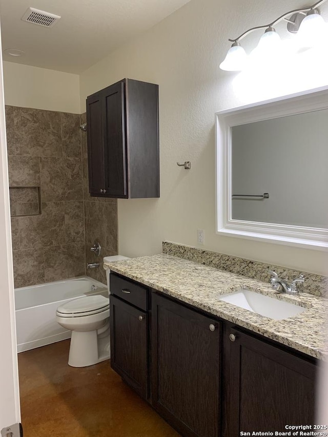 full bathroom featuring tiled shower / bath combo, vanity, and toilet