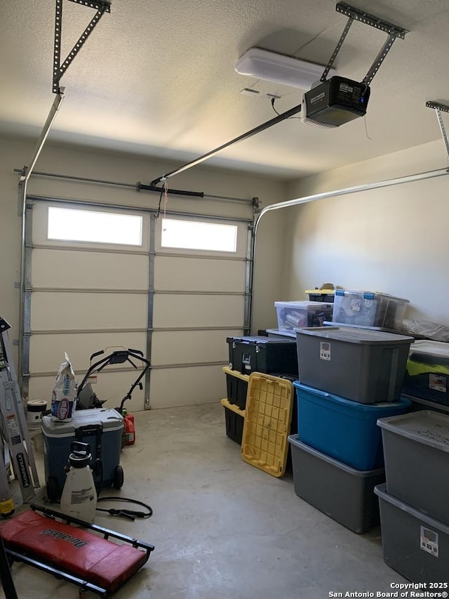 garage featuring a garage door opener