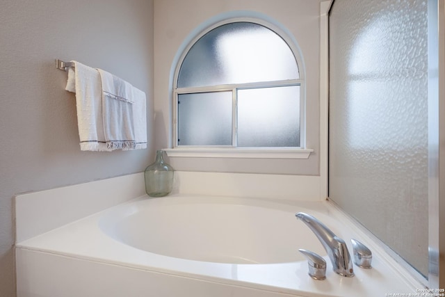 bathroom featuring a tub