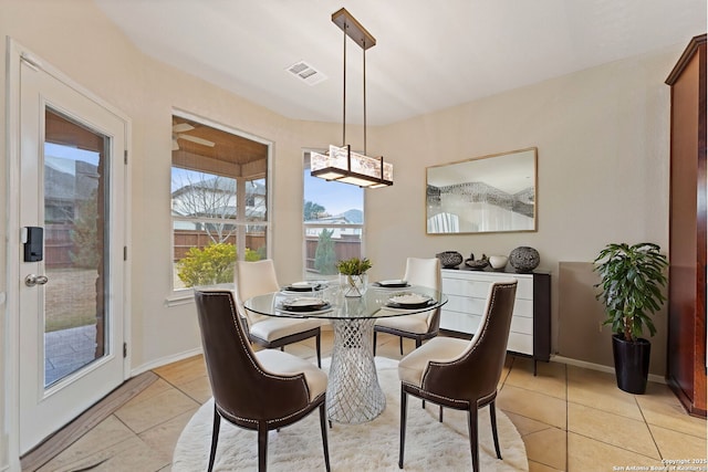 dining area featuring light tile patterned flooring