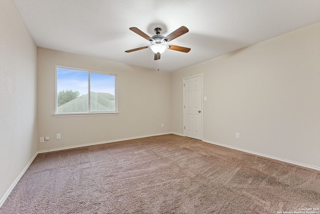 carpeted empty room with ceiling fan