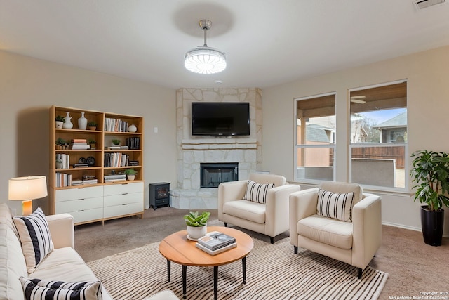 carpeted living room with a fireplace