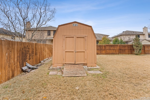 view of outbuilding featuring a lawn