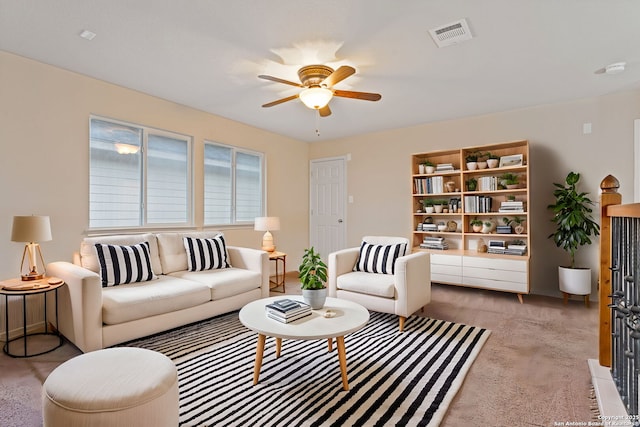 living room with light carpet and ceiling fan