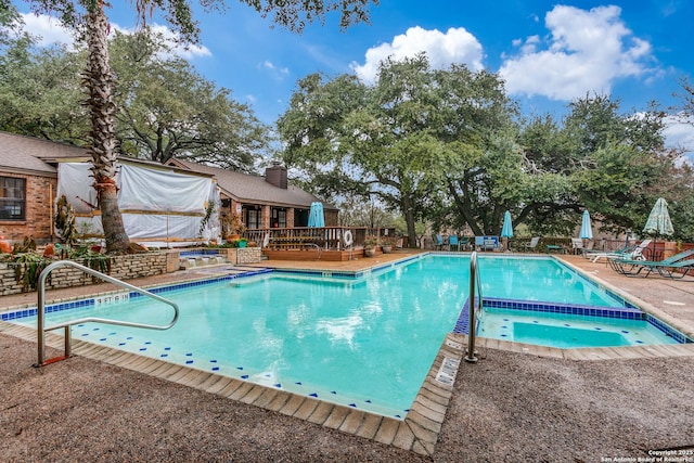 view of pool featuring a community hot tub