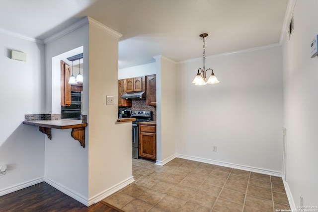 kitchen featuring pendant lighting, a breakfast bar area, an inviting chandelier, stainless steel electric range oven, and kitchen peninsula