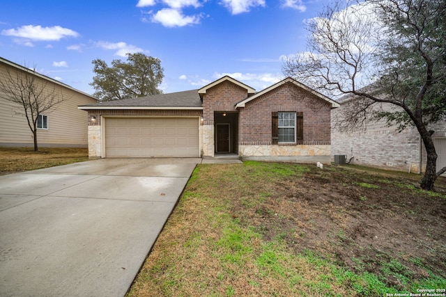 ranch-style house featuring cooling unit, a garage, and a front lawn