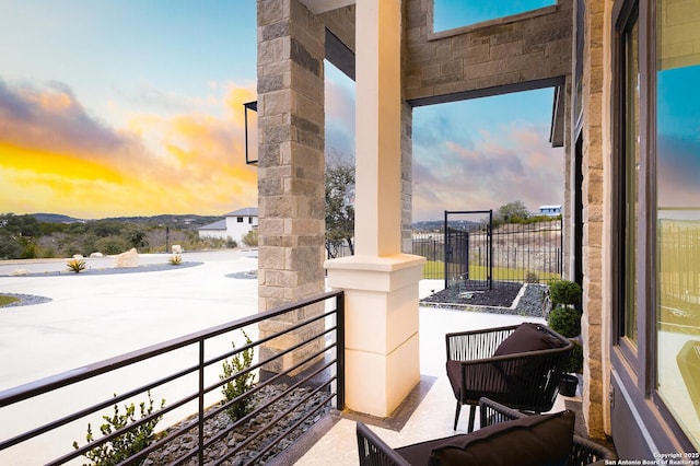 view of balcony at dusk