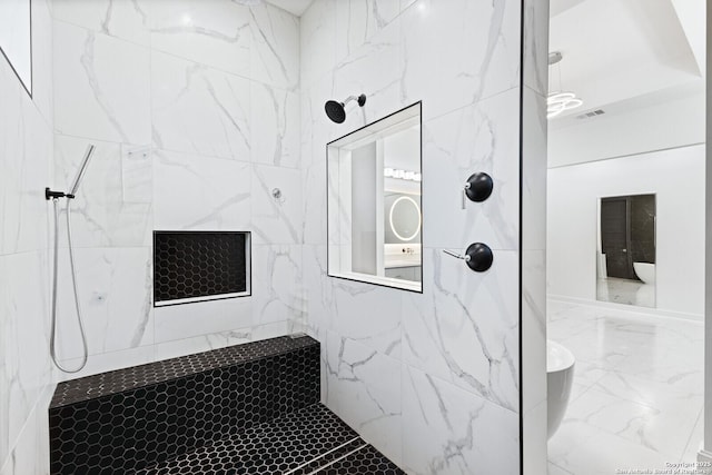 bathroom featuring a tile shower