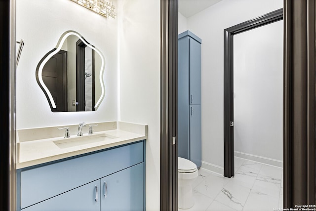 bathroom with vanity and toilet