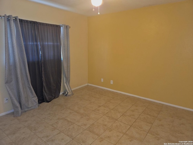 empty room with baseboards