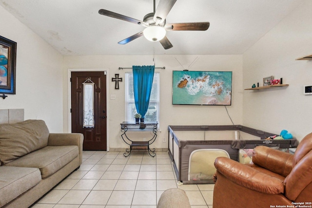 living room with light tile patterned floors and a ceiling fan