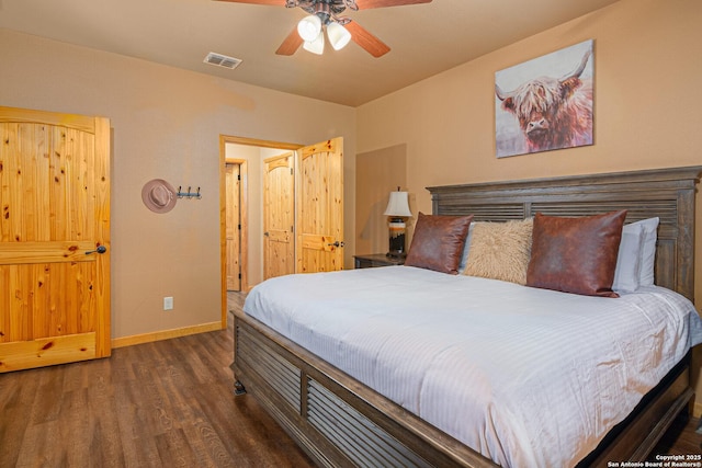 bedroom featuring dark wood-type flooring and ceiling fan