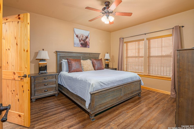 bedroom featuring dark hardwood / wood-style floors and ceiling fan