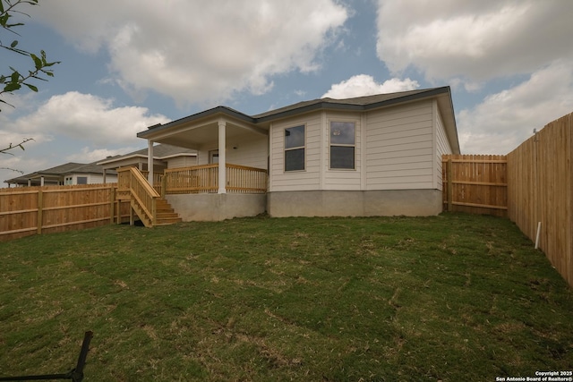 15478 Jake Xing, San Antonio, TX 78245 - rear view of house with a fenced backyard and stairway