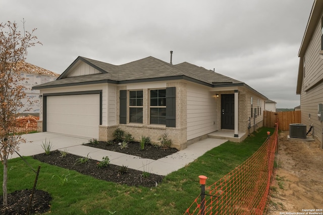 15478 Jake Xing, San Antonio, TX 78245 - ranch-style home with driveway, a garage, and roof with shingles