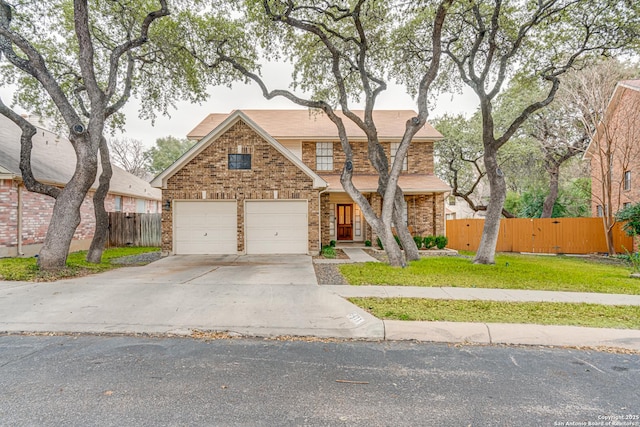 view of front of house with a garage and a front lawn