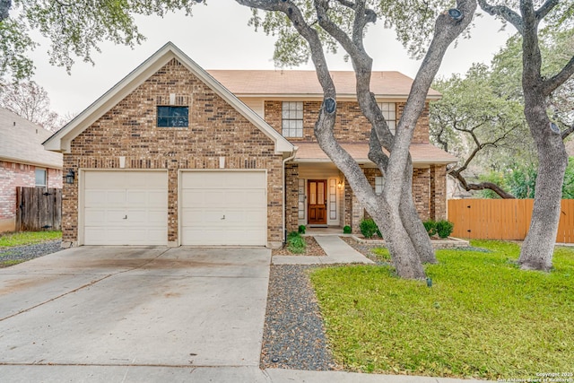 view of front of home with a garage and a front lawn