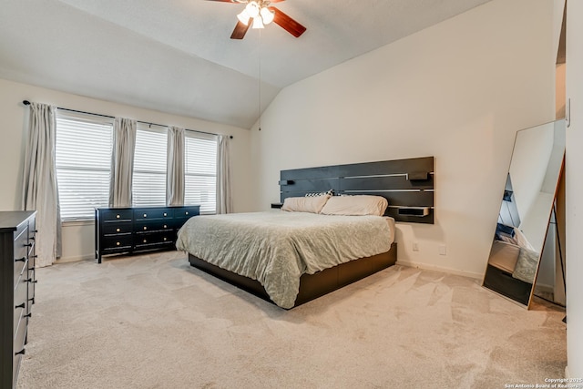 bedroom featuring lofted ceiling, ceiling fan, and carpet