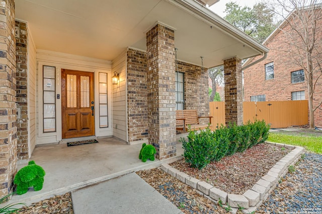 property entrance with covered porch