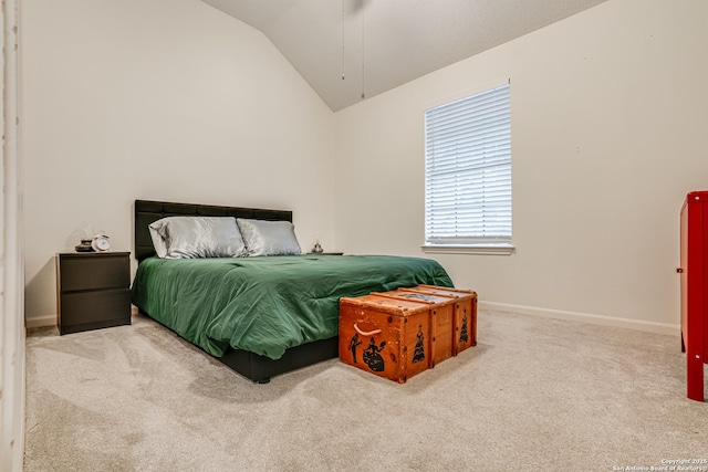 bedroom with lofted ceiling and carpet flooring