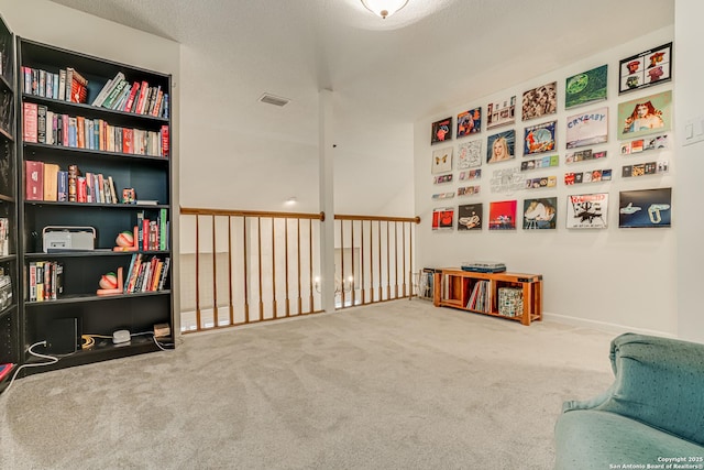 living area featuring carpet flooring