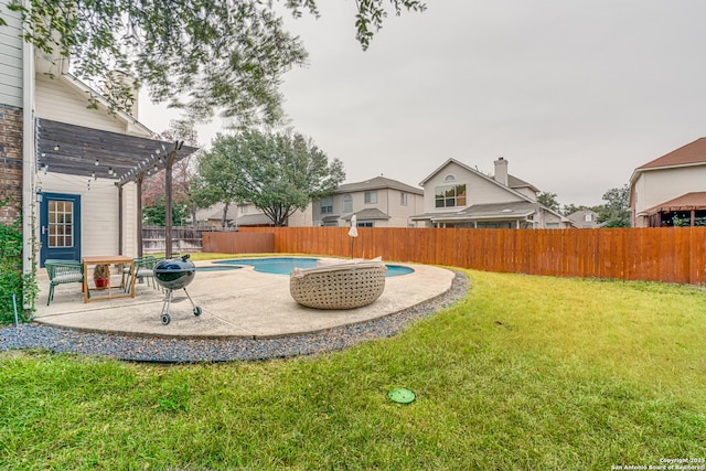 view of yard with a fenced in pool and a pergola