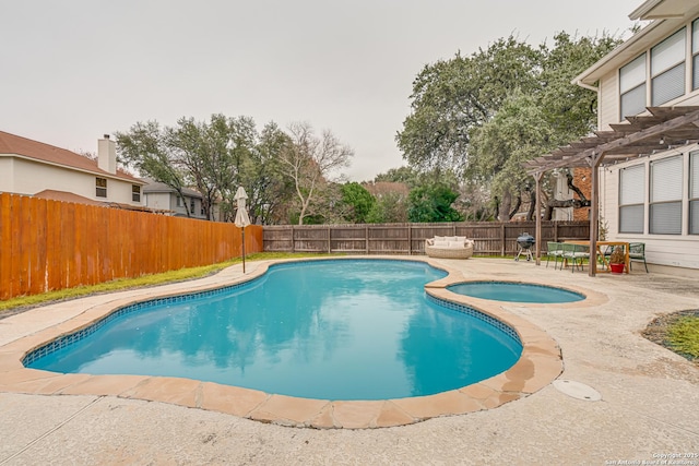 view of pool featuring an in ground hot tub, a patio, and a pergola