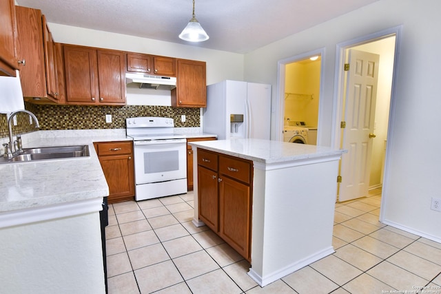 kitchen with pendant lighting, sink, white appliances, a center island, and light tile patterned flooring