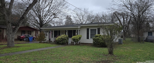 view of front of property with cooling unit and a front lawn